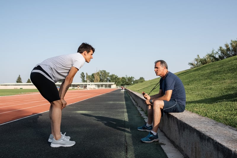 sportsman-listening-to-coach-smart-health-goals