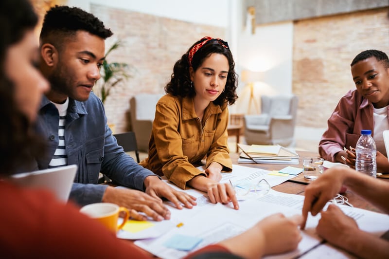 team-of-employees-working-on-a-project-together-how-to-set-goals-and-achieve-them